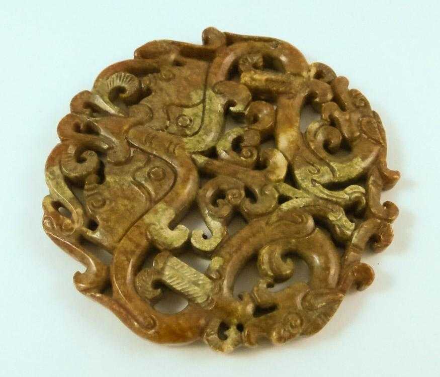 Appraisal: CHINESE CARVED JADE PENDANT The brown and green carved jade