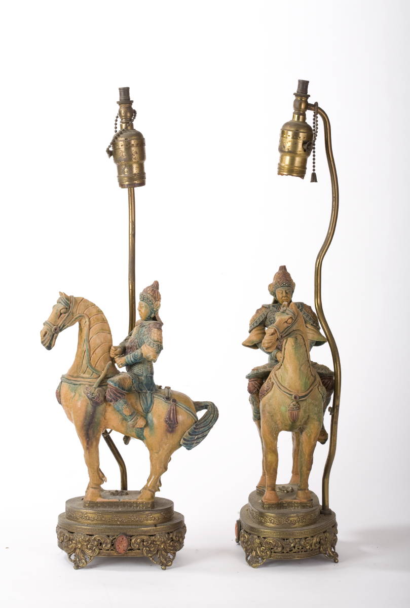 Appraisal: PAIR OF TANG STYLE GLAZED POTTERY SOLDIERS ON HORSEBACK NOW