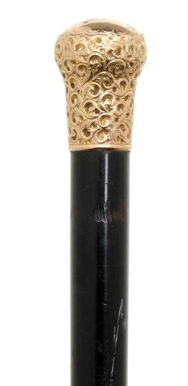 Appraisal: AN EDWARD VII GOLD-MOUNTED EBONY WALKING CANE the pommel embossed