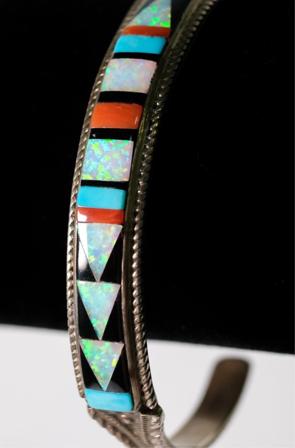 Appraisal: ZUNI STERLING MULTI STONE INLAY CUFF SIGNEDZuni sterling silver multi-stone