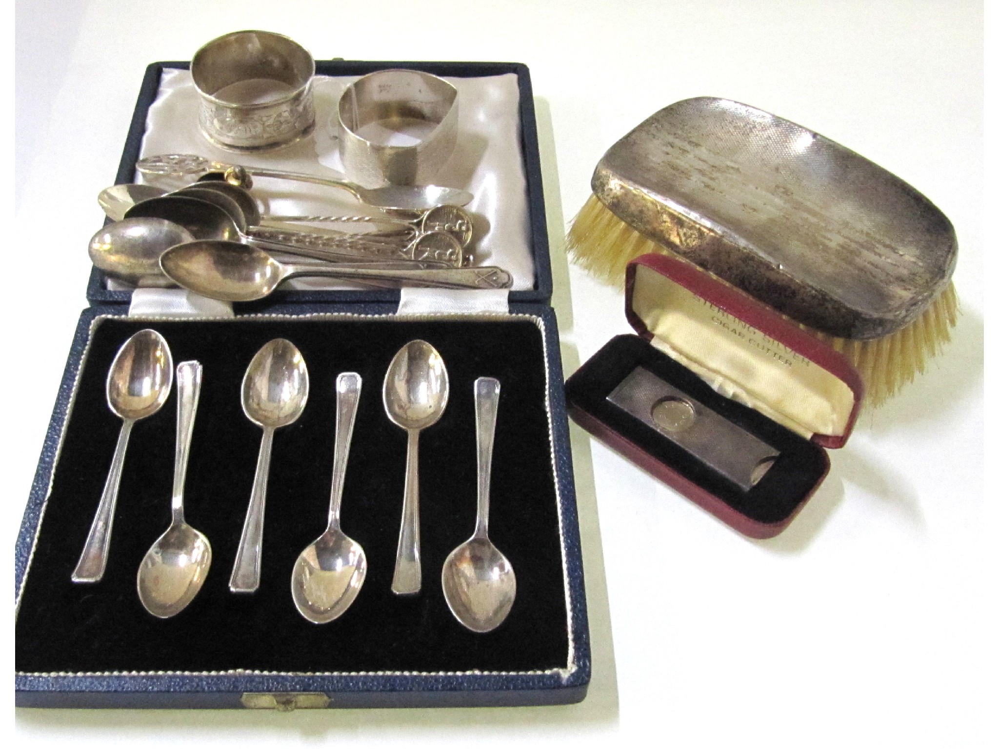 Appraisal: A lot comprising cased silver teaspoons loose spoons a cigar