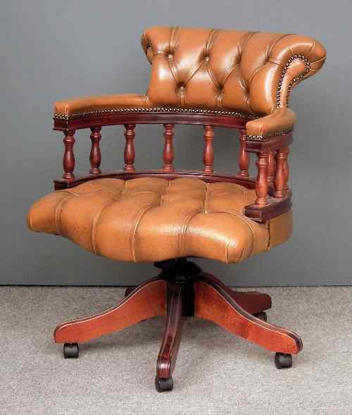 Appraisal: A modern stained wood ''Captains'' tub shaped swivel office armchair