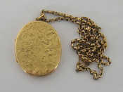 Appraisal: A carat gold locket scroll engraved overall cm long on