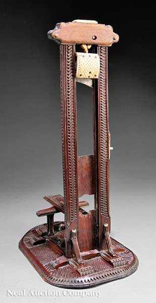 Appraisal: An Antique French Carved Walnut and Ivory Guillotine Cigar Cutter