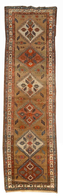 Appraisal: A NORTH WEST PERSIAN BROWN GROUND RUNNER with six interlinked