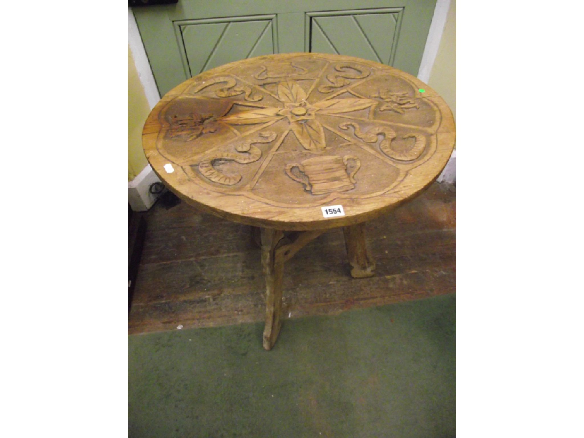 Appraisal: A th century rustic pine occasional table the circular top