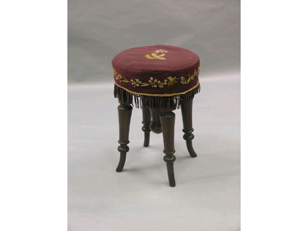 Appraisal: A Victorian rosewood revolving piano stool upholstered seat above turned