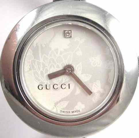 Appraisal: LADY'S GUCCI QUARTZ WRISTWATCH series model YA round silver flower