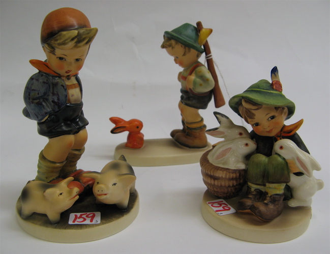 Appraisal: FOUR GERMAN HUMMEL FIGURES all TM- including Farm Boy HUM