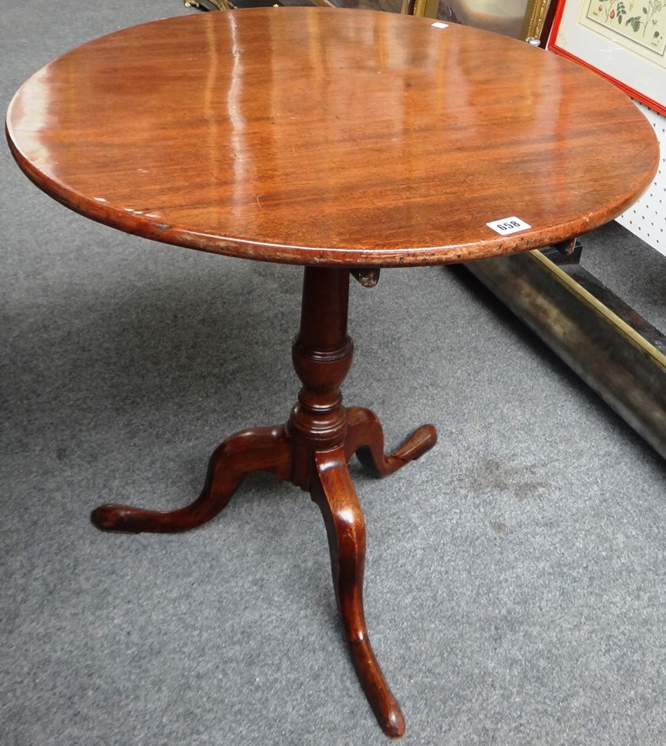 Appraisal: A George III mahogany occasional table the circular snap top