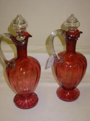 Appraisal: A PAIR OF VICTORIAN CRANBERRY GLASS CLARET JUGS of mildly