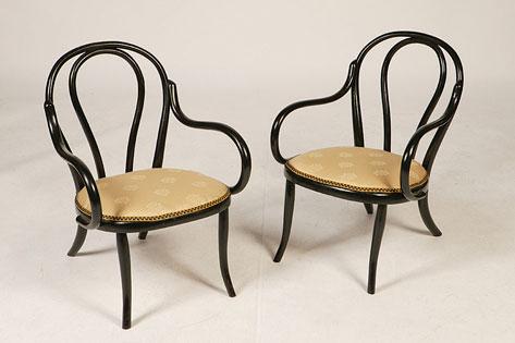 Appraisal: JOSEPH HOFMANN A pair of Bentwood low chairs of scrolling