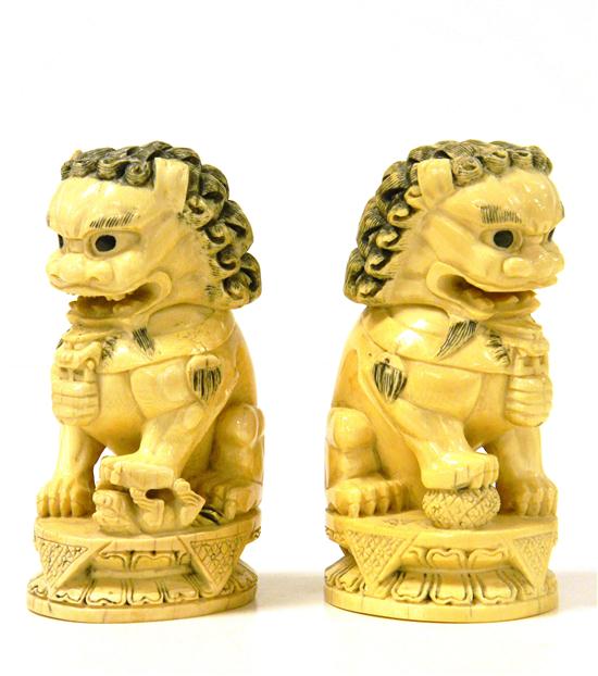 Appraisal: Pair of carved ivory foo dogs Asian th C signed