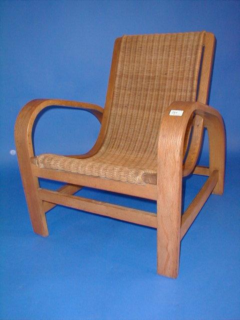 Appraisal: An oak bentwood Arts Crafts open arm chair with a