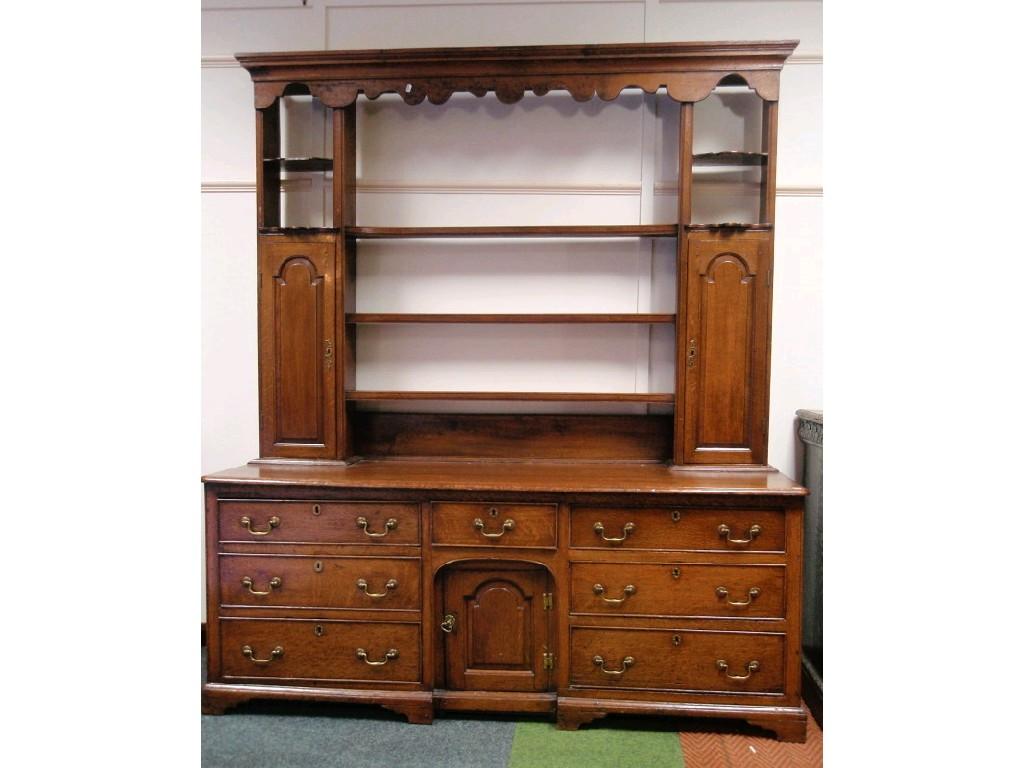 Appraisal: A George III oak dresser with moulded and shaped canopy