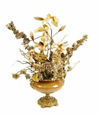 Appraisal: A th century caramel glazed ceramic and gilt brass mounted