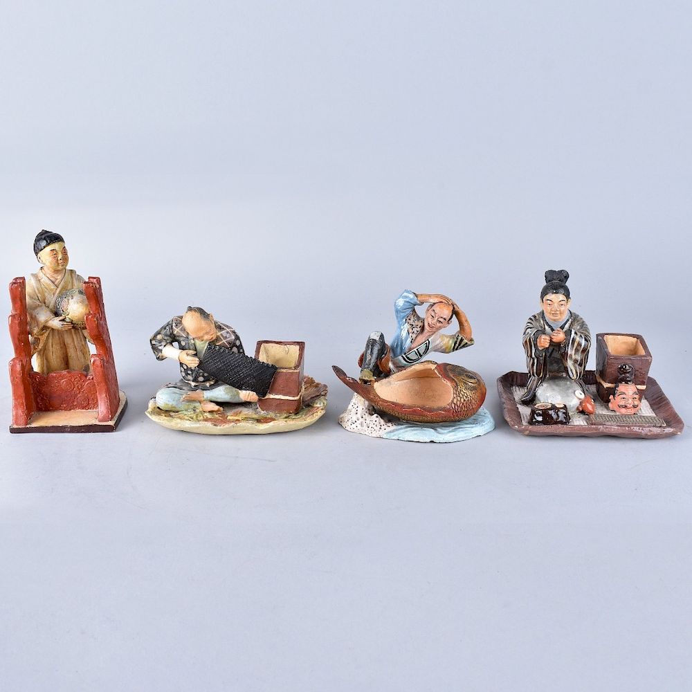 Appraisal: Four Japanese Pottery Figures Four Vintage Japanese Painted Pottery Figures