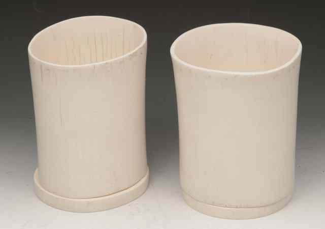 Appraisal: A PAIR OF CHINESE PLAIN IVORY BRUSH POTS on stands