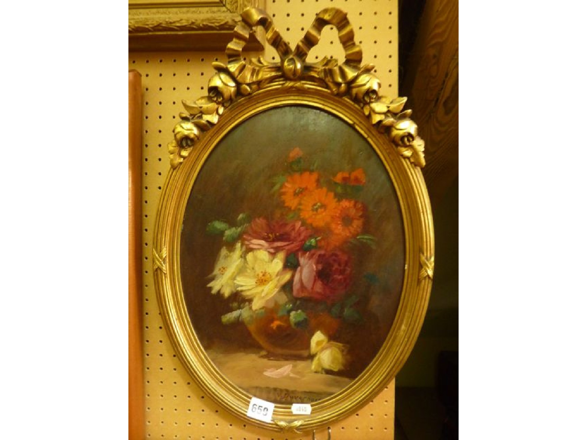 Appraisal: An oil painting on board of oval form showing a