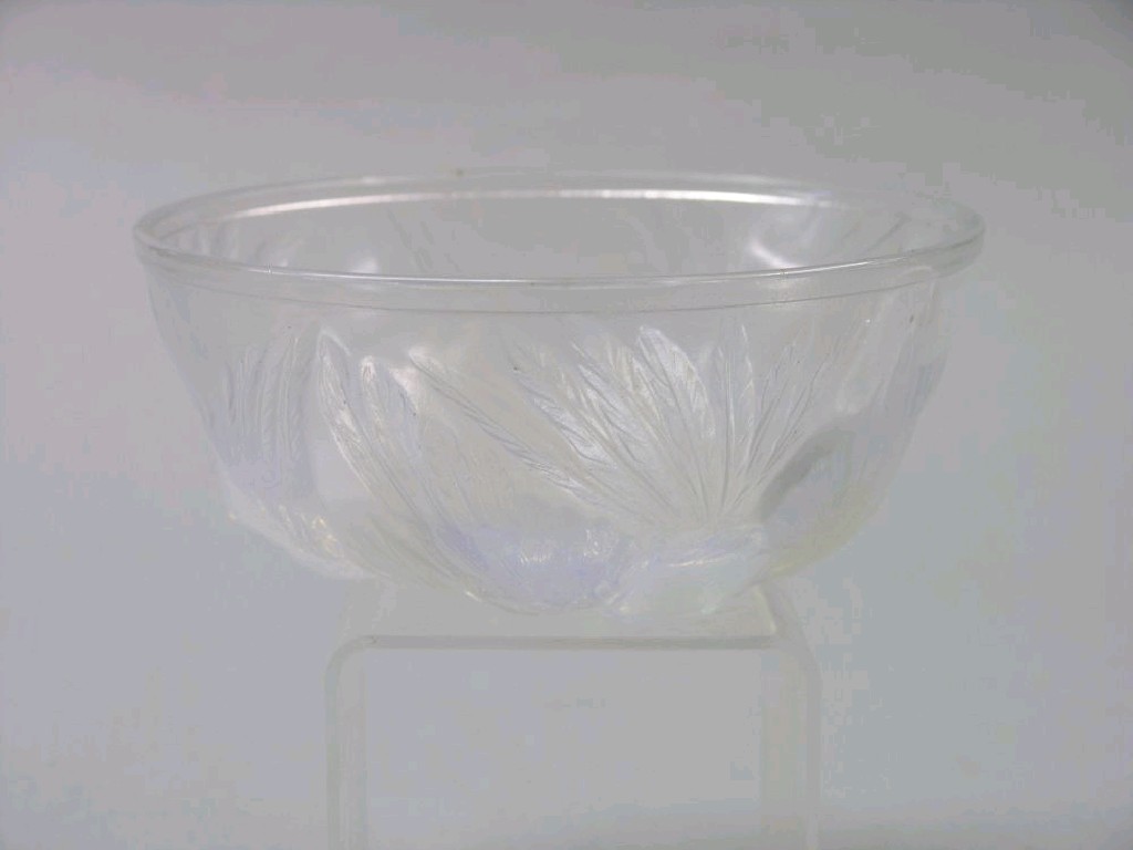 Appraisal: A Lalique-style opalescent glass fruit bowl press moulded with three