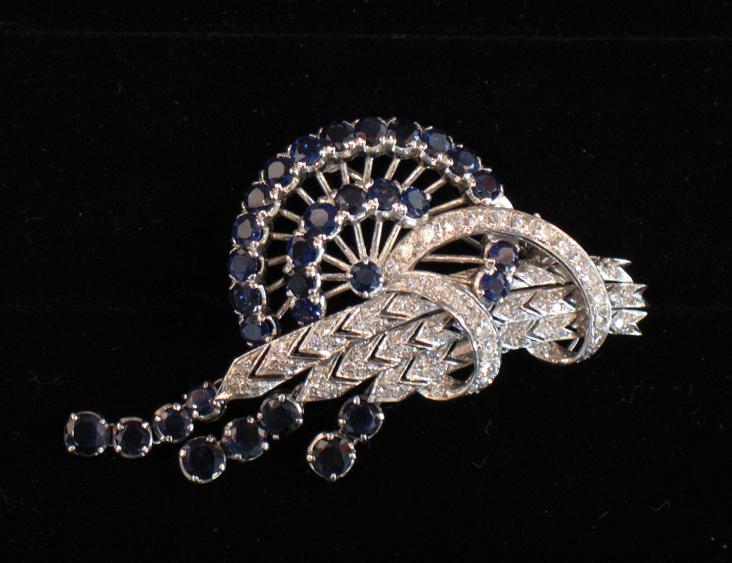 Appraisal: A 'S SAPPHIRE AND DIAMOND BROOCH the three pave-set diamond