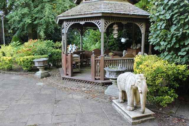 Appraisal: A PAIR OF HADDONSTONE GOTHIC STYLE OCTAGONAL PLANTERS on conforming