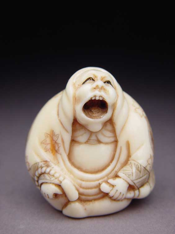 Appraisal: CARVED IVORY NETSUKE Contemporary carved ivory netsuke of a seated