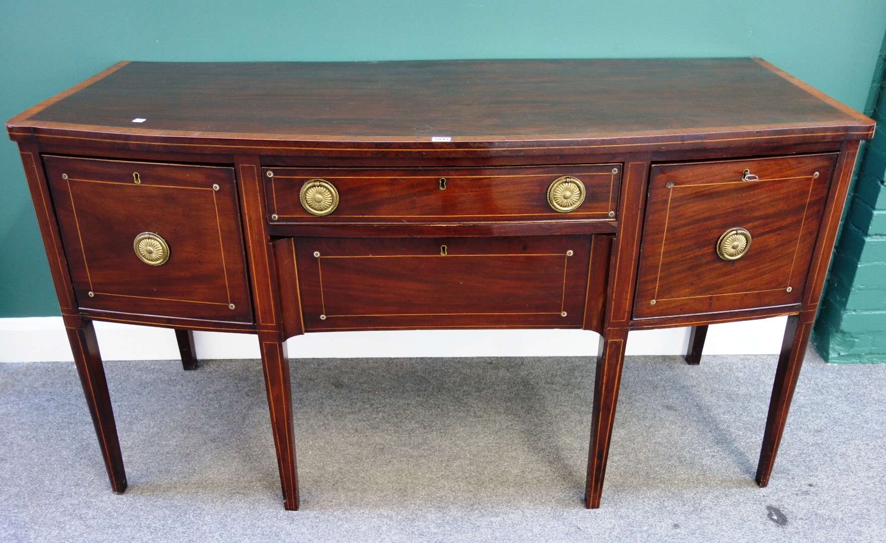 Appraisal: A Regency inlaid mahogany bowfront sideboard with five frieze drawers