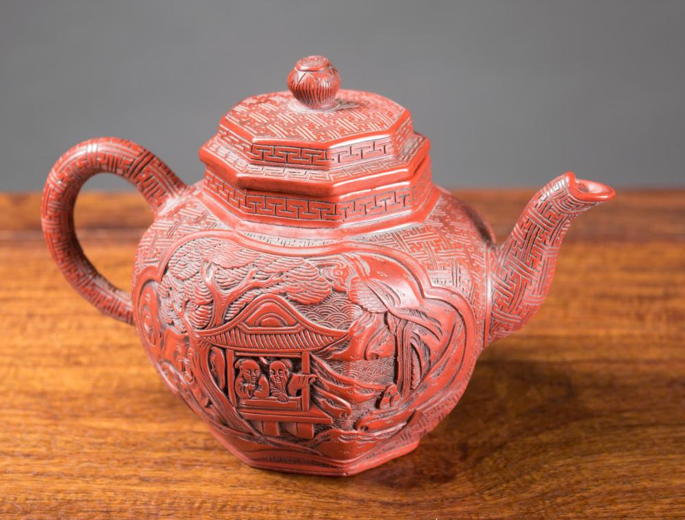 Appraisal: CHINESE CINNABAR OVERLAY ZISHA TEAPOT octagonal form and featuring reserves