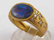 Appraisal: A yellow metal tests carat gold opal and diamond ring