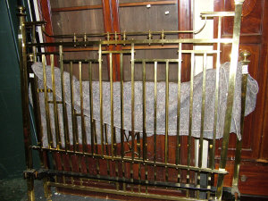 Appraisal: An Edwardian brass ' double bed with vertical spars