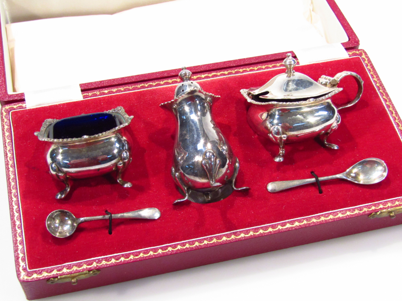 Appraisal: An Elizabeth II silver cruet set comprising mustard pot open