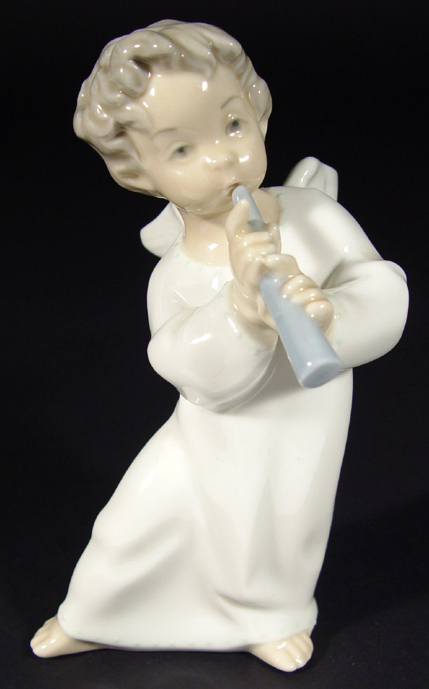 Appraisal: Lladro porcelain angel playing a flute with hand painted decoration