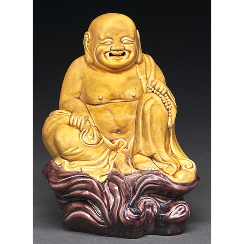 Appraisal: A Chinese straw yellow and aubergine glazed biscuit figure of