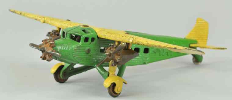 Appraisal: KILGORE ''TAT'' AIRPLANE Cast iron green and yellow version embossed