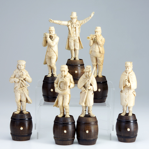 Appraisal: Carved ivory band of musicians set of seven each on