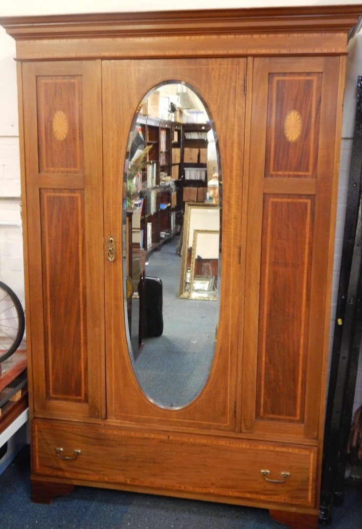 Appraisal: An Edwardian mahogany wardrobe with cross banded and paterae inlay