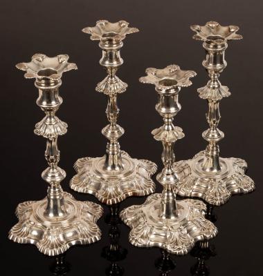 Appraisal: A pair of George II cast silver candlesticks John Quantock