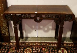 Appraisal: Altar table in rosewood circa with carved and pierced apron