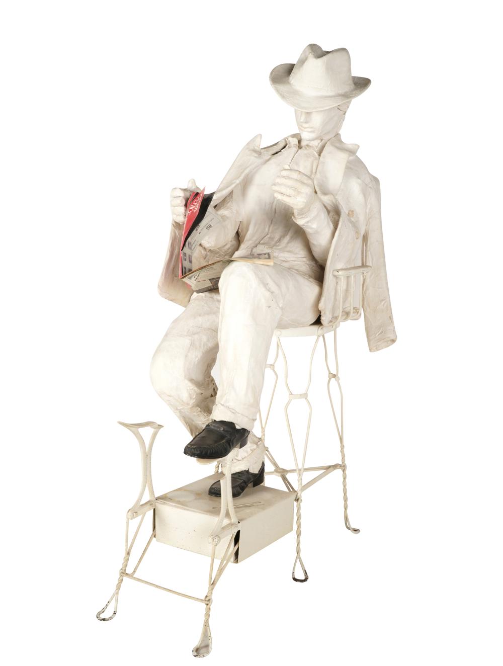 Appraisal: UNKNOWN ARTIST MAN READING IN CHAIRmixed media papier mache leather