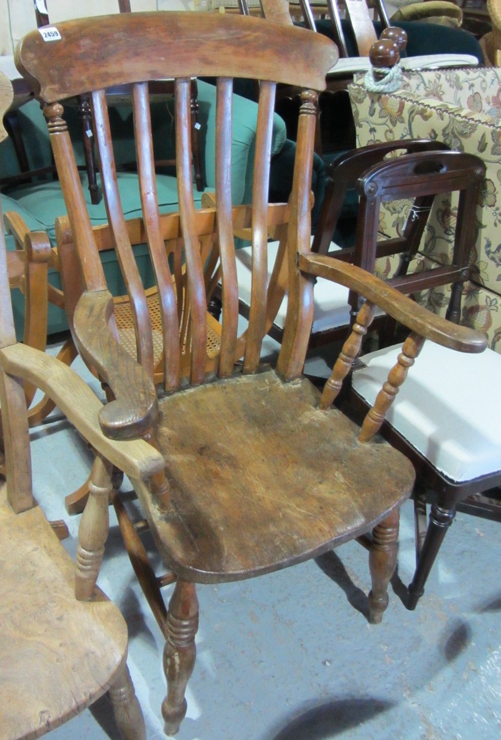 Appraisal: A th century stick back armchair and two mahogany dining