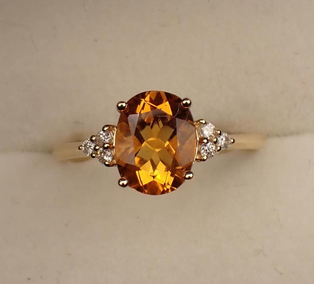 Appraisal: CITRINE DIAMOND AND FOURTEEN KARAT GOLD RING The yellow gold