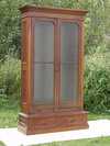 Appraisal: BOOKCASE - Two part Victorian walnut bookcase wide molded top