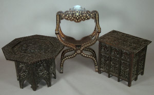 Appraisal: A Moorish stained wood and ivory inlaid X-frame open armchair