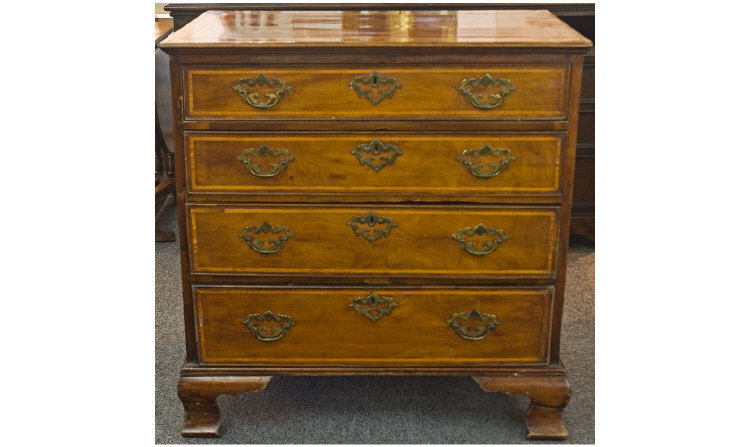 Appraisal: George II Walnut chest of drawers with four graduated drawers