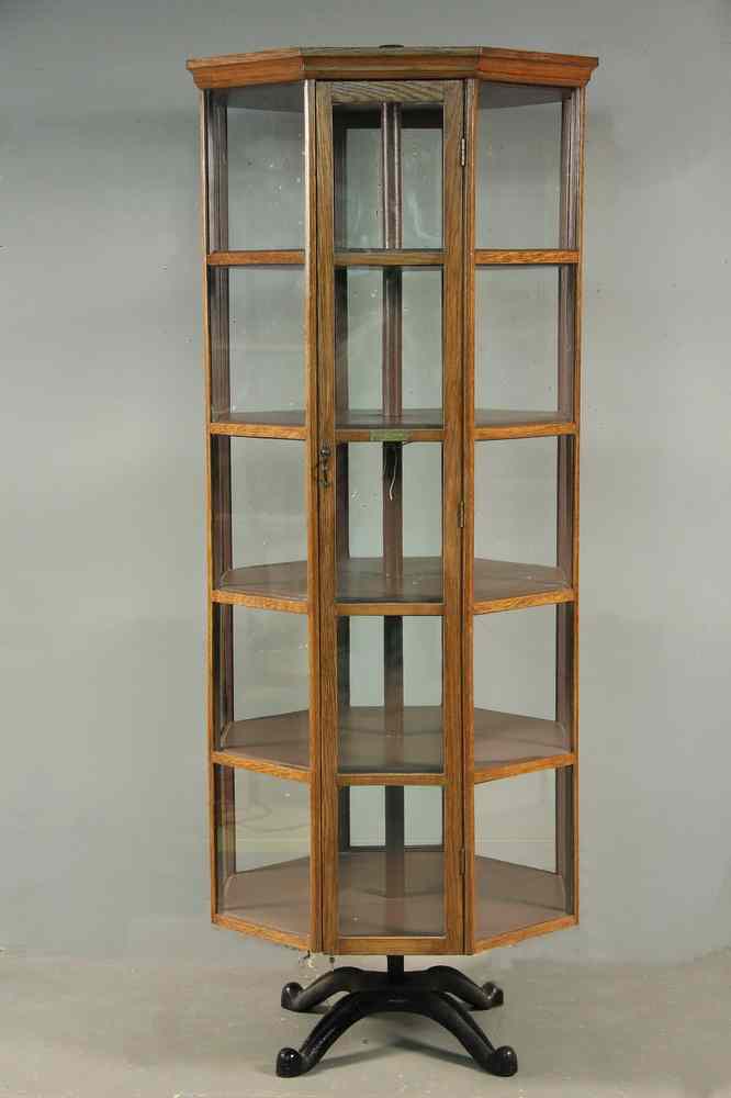 Appraisal: OCTAGONAL UPRIGHT ROTATING DISPLAY CASE - Oak and Glass Rotating