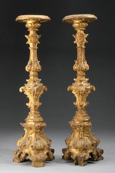 Appraisal: A pair of Italian Baroque giltwood prickets th th century