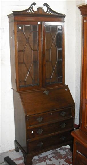 Appraisal: A George III style astragal glazed mahogany bureau bookcase with