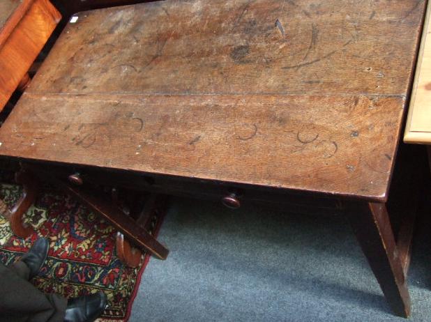 Appraisal: An th century oak single drawer side table on tapering