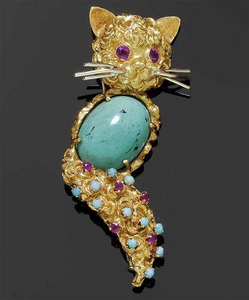 Appraisal: GOLD AND RUBY BROOCH ca Yellow gold Decorative brooch in